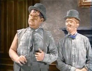 Oliver Hardy and Stan Laurel as dirty chimney sweeps in "Dirty Work"