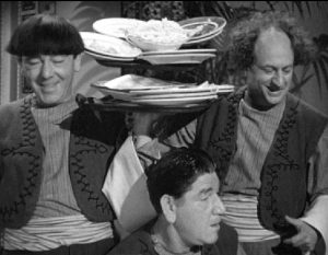 Moe, Shemp, and Larry about to make a mess in their restaurant in "Malice in the Palace"